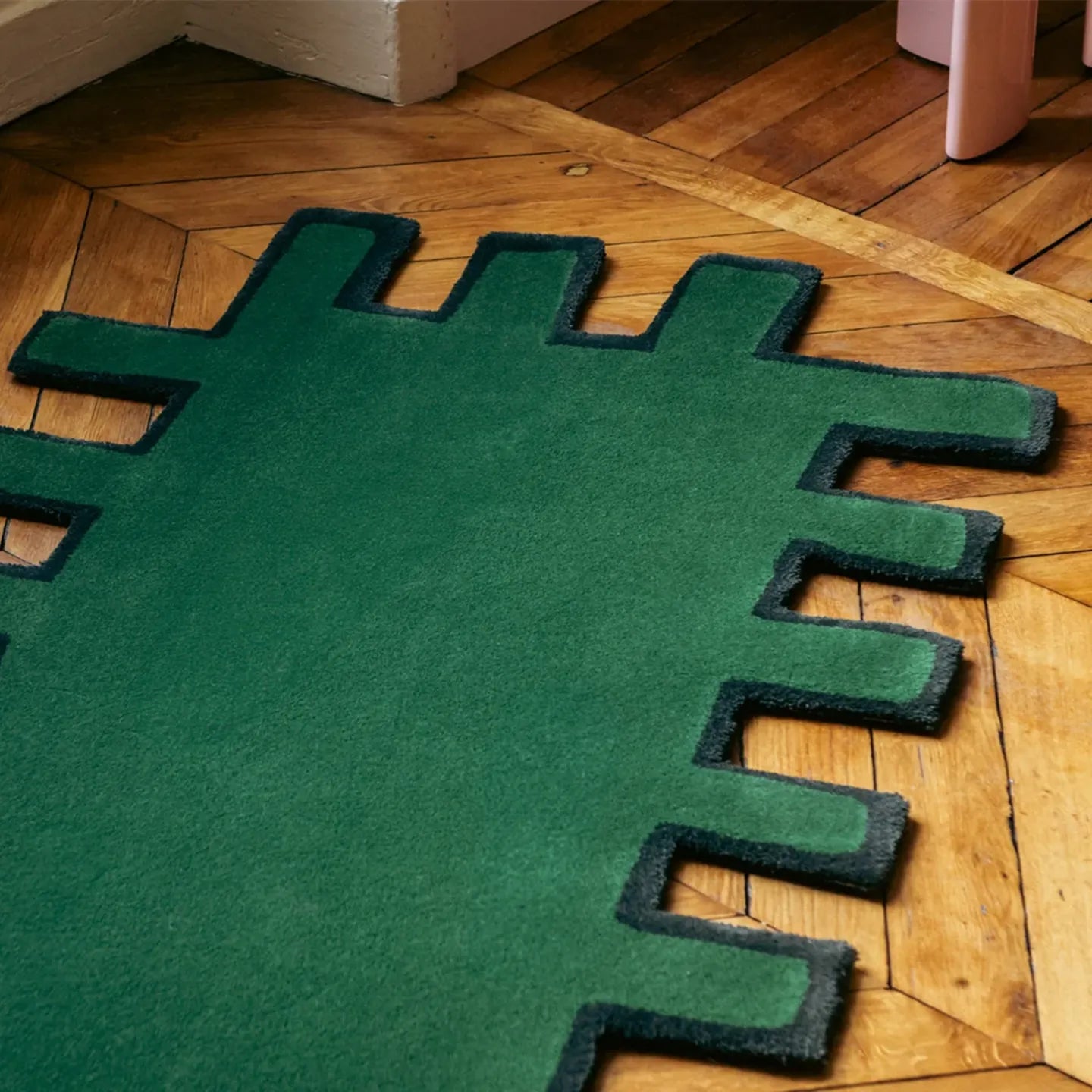 Biscuit Green shaggy abstract geometric rug with black border by Housenfriends on wooden floor
