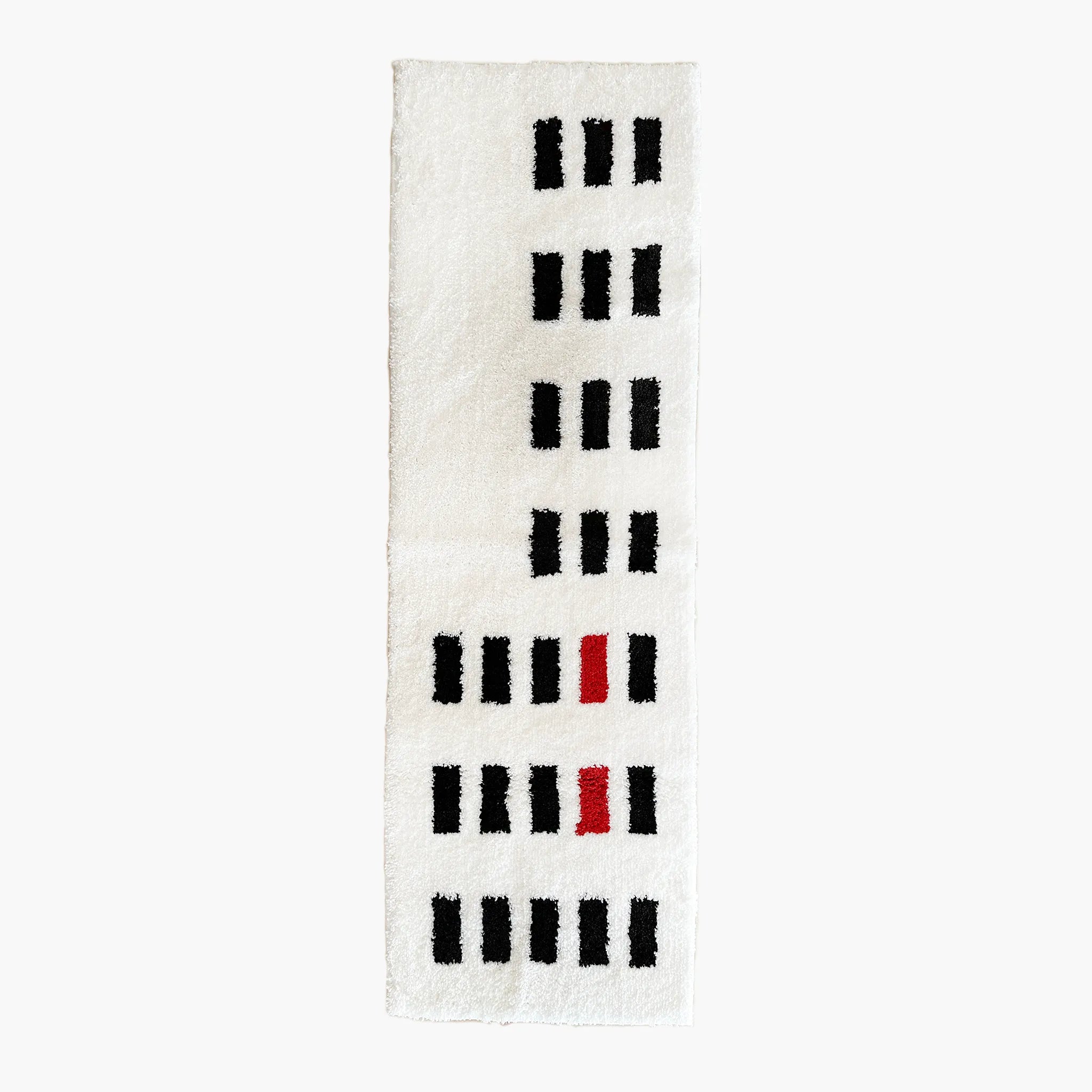 Arlo White and Black Asymmetric Checkered Tufted Runner Rug by Housenfriends on a white background