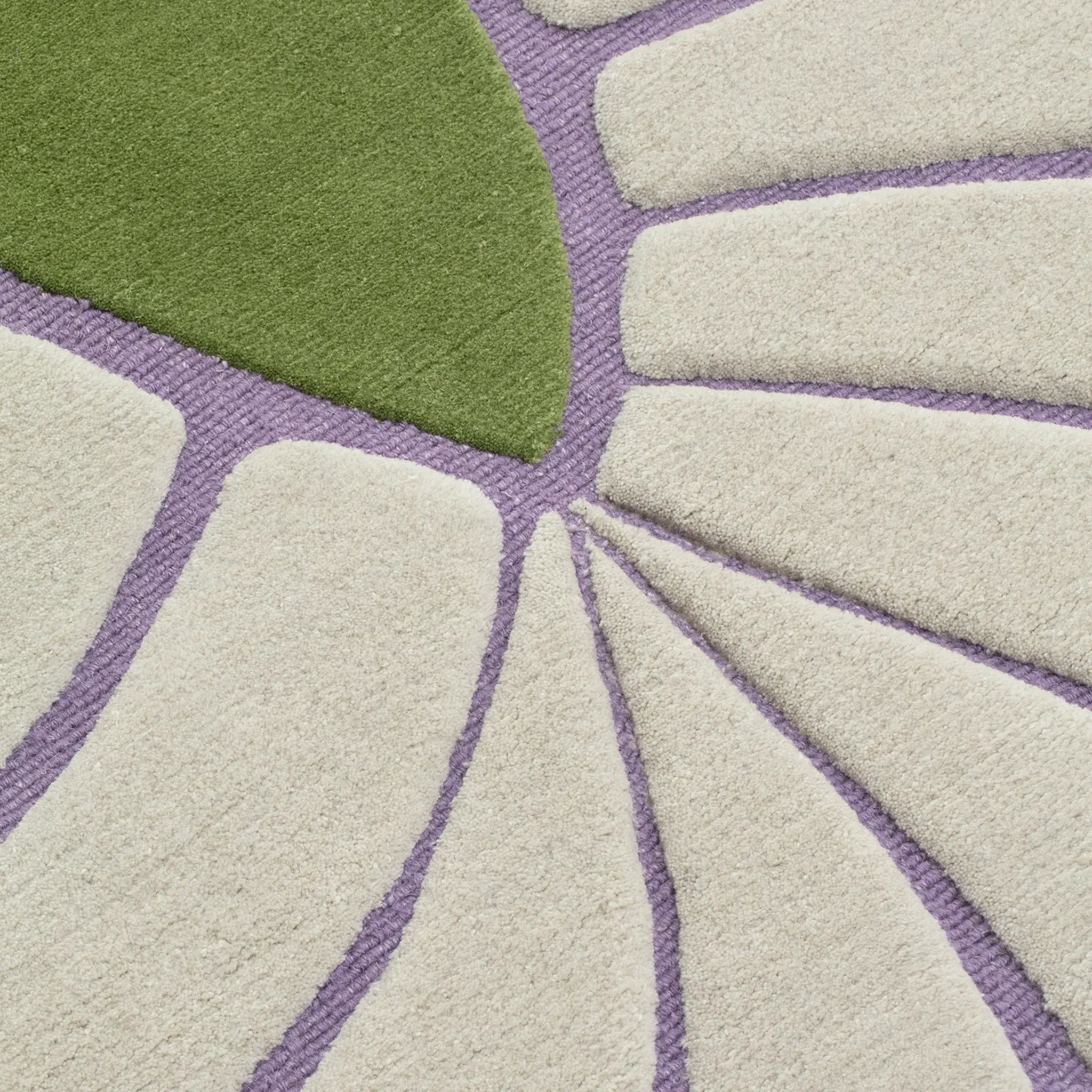 Close-up of a texture of Coquille Green Seashell Shaped Sculpted Rug with cream ribbed boarder by Housenfriends