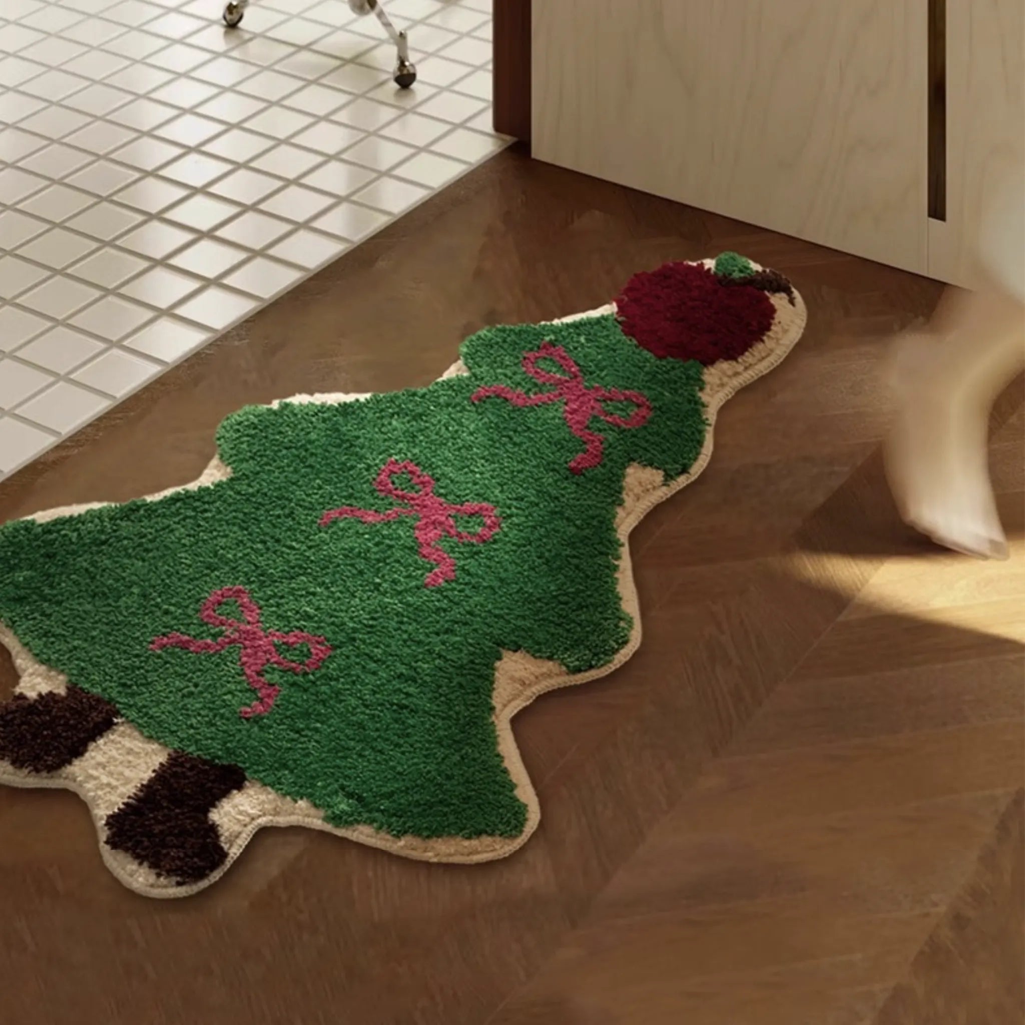 Sprout Irregular Tufted Rug shaped like a Christmas tree with ribbons on a wooden floor.