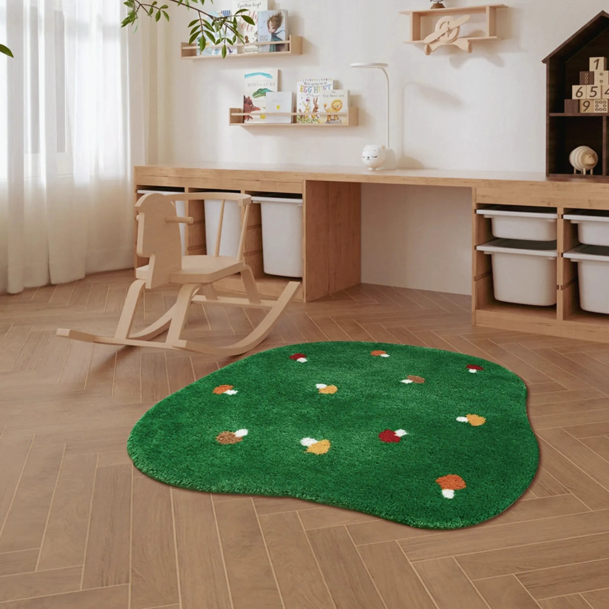 Elora Moss Green Round Mushroom Rug by Housenfriends on a wooden floor with a desk and rocking chair.