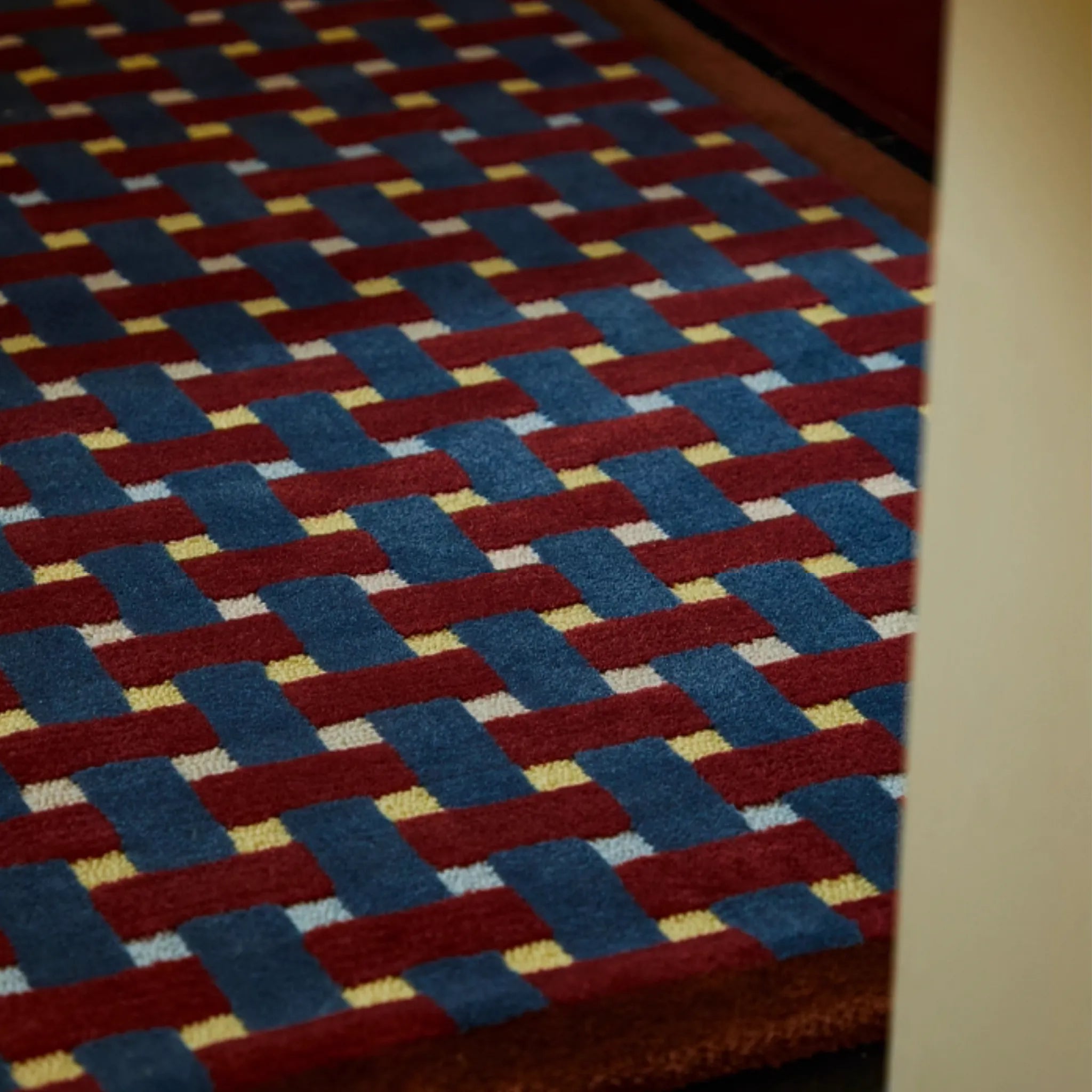 Close-up of Mondrian Red Navy Beige Retro Checkered Wool Rug by Housenfriends