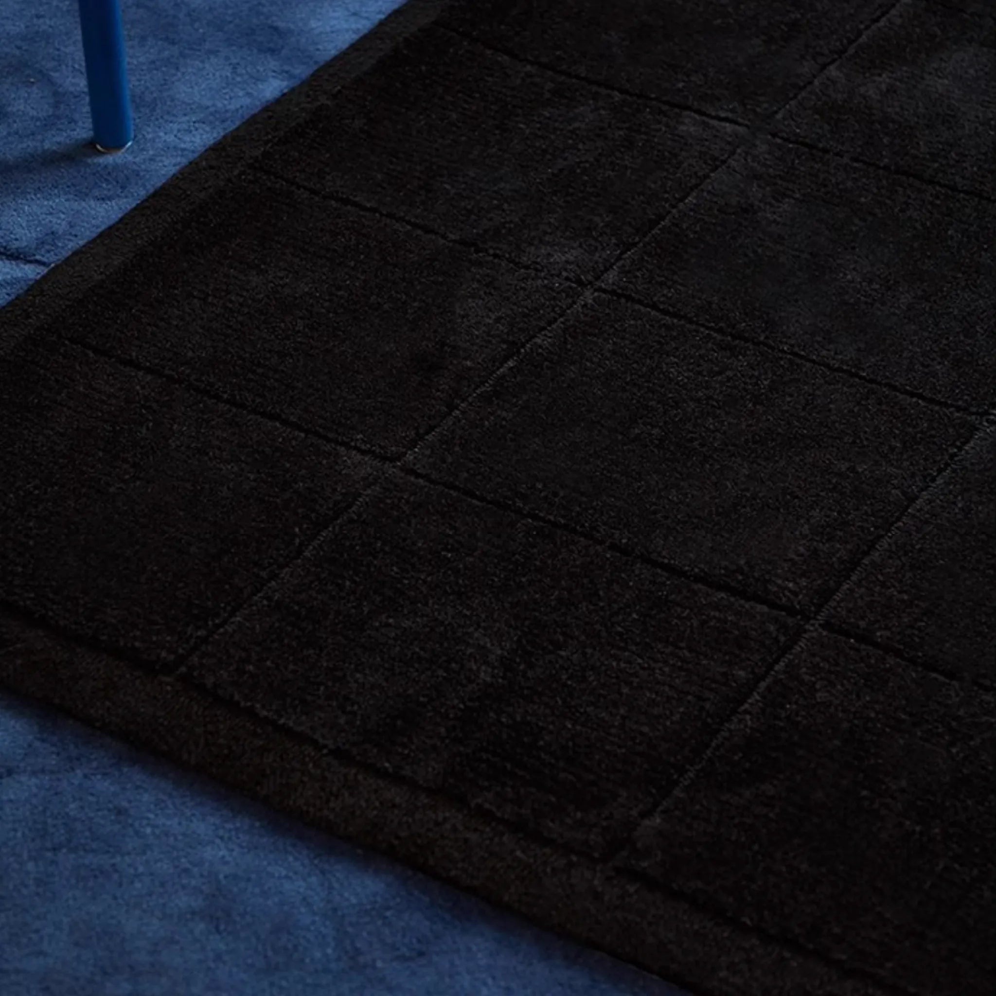Close-up of the texture of Pure Black Minimalist Modern High Low Tufted Rug by Housenfriends