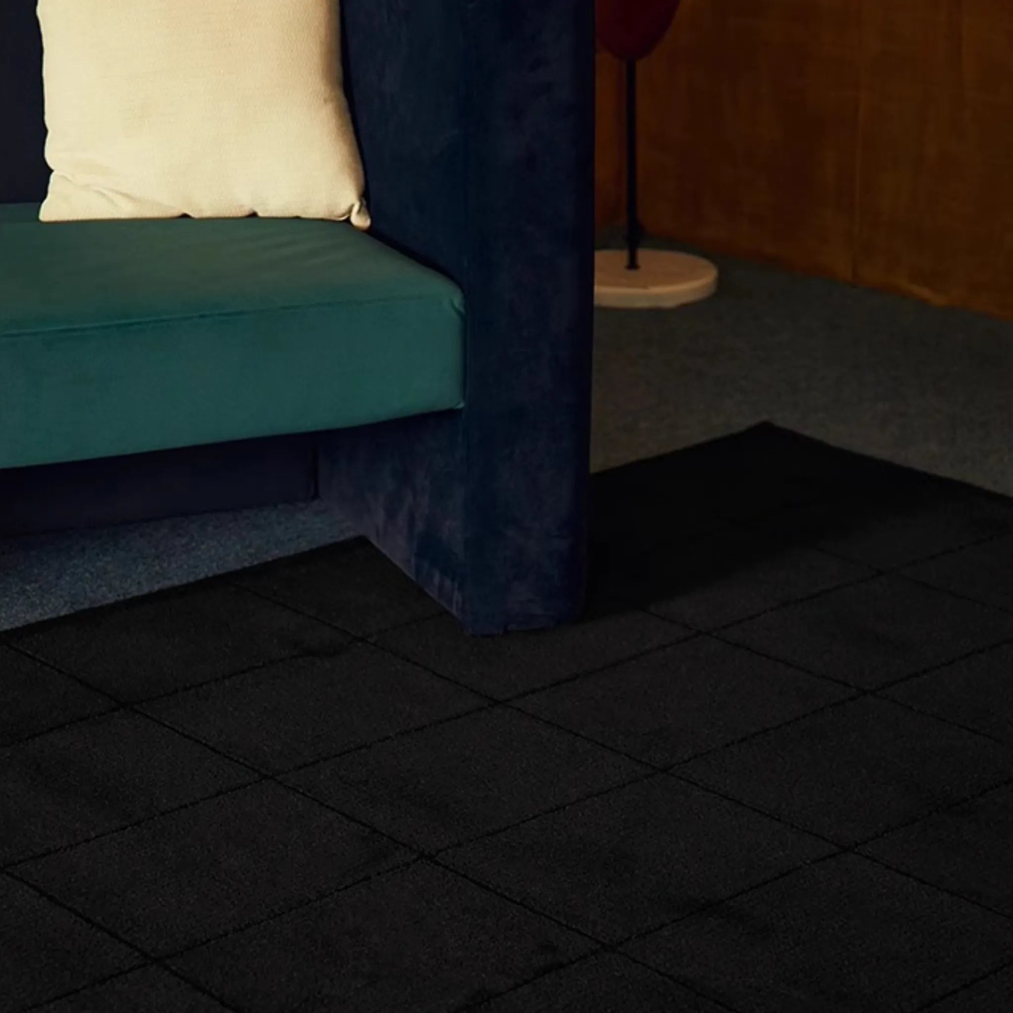 Pure Black Minimalist Modern High Low Tufted Rug by Housenfriends with a blue couch and white pillow