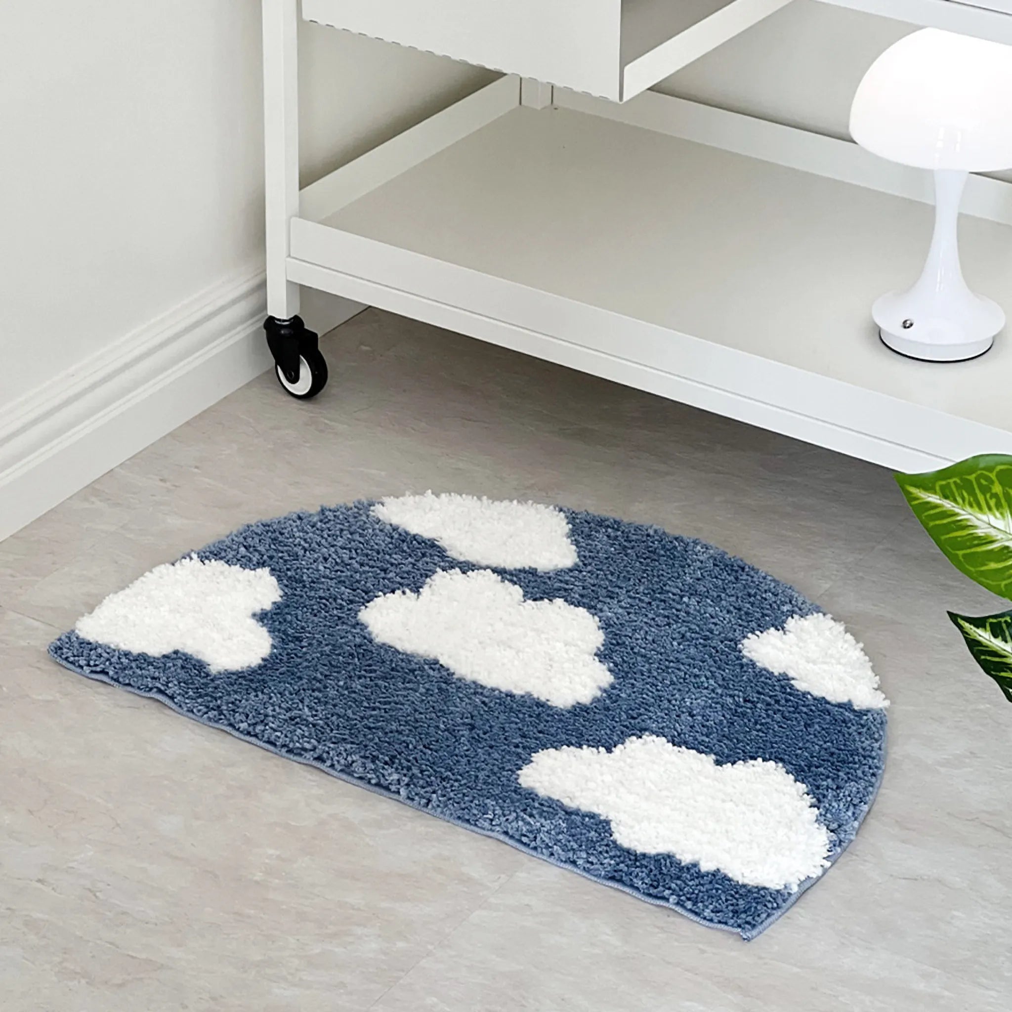 Seren Blue & White Half-Moon Cloud Tufted Rug by Housenfriends  on a light floor.