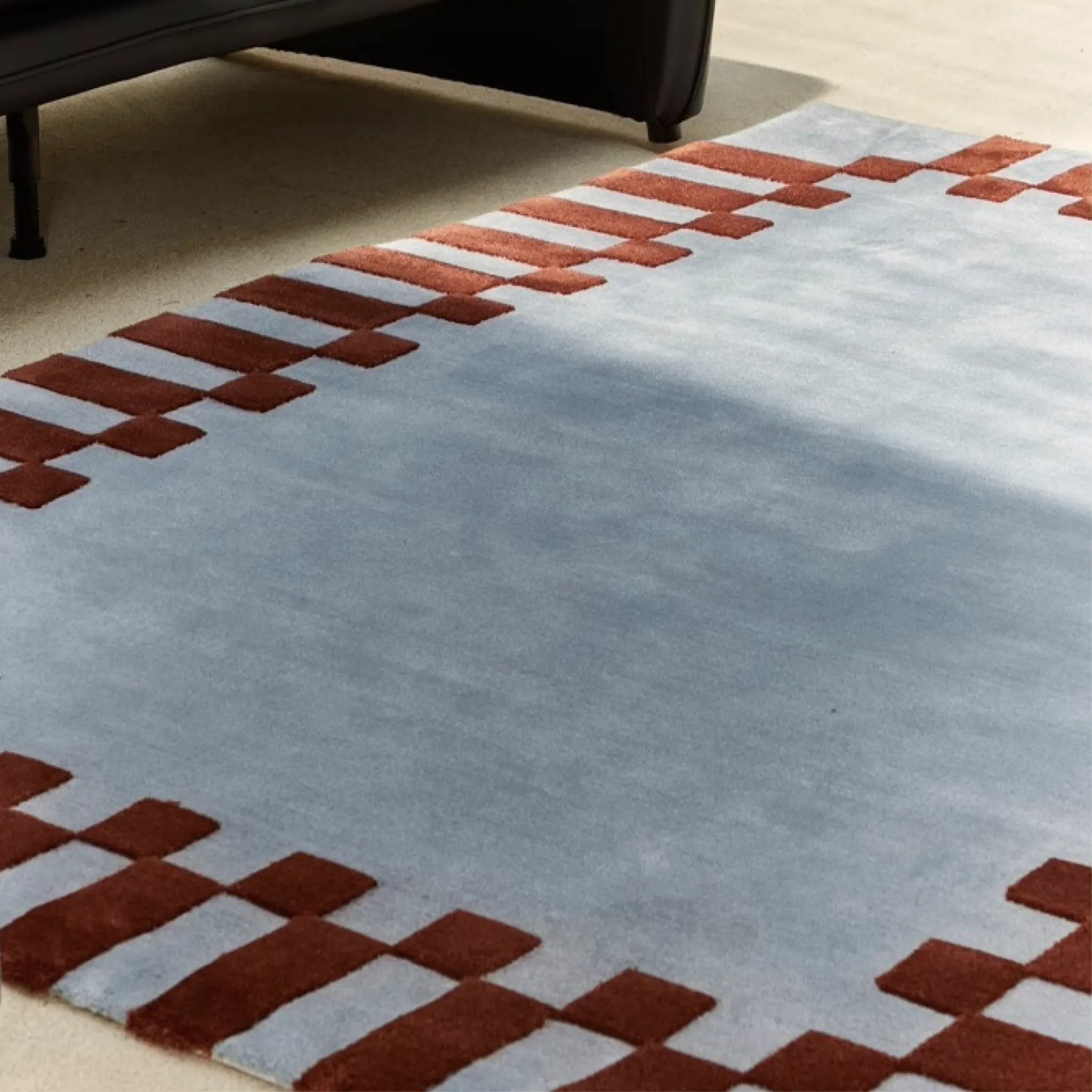 Close-up of Acropolis Slate Blue and Red High Low Tufted Wool Rug by Housenfriends on floor