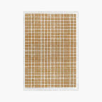 White rug with caramel gold grid pattern by Housenfriends