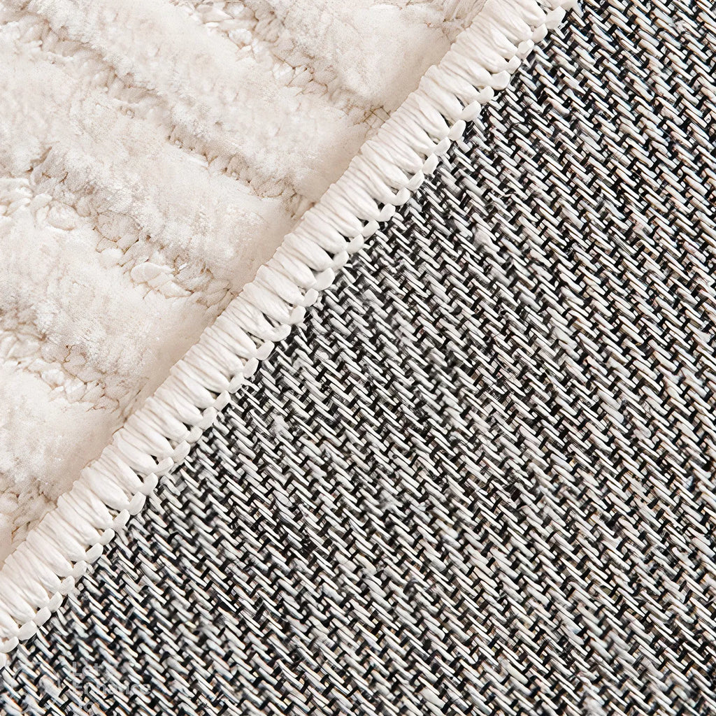 Close-up of the backing of Rae off-white minimalist rug by Housenfriends