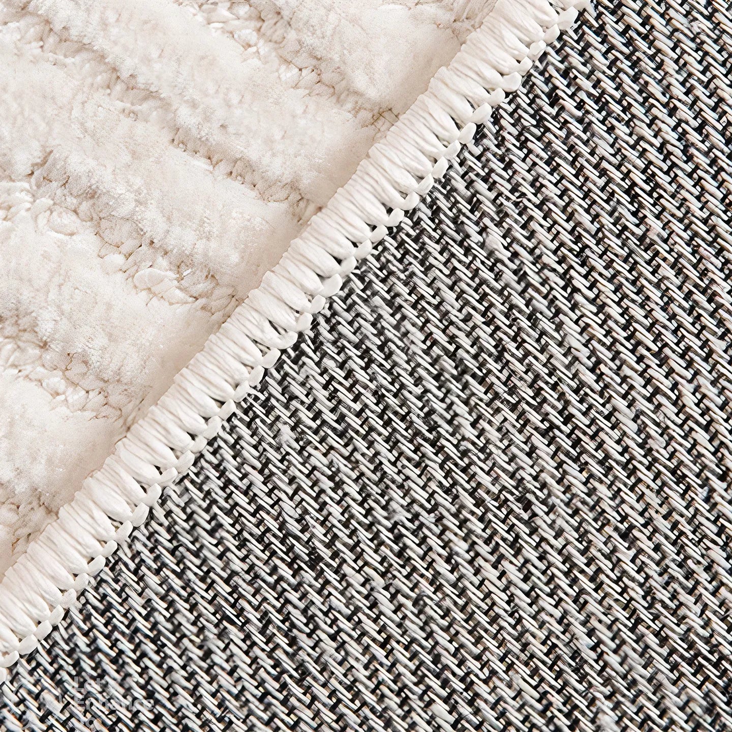 Close-up of the backing of Rae off-white minimalist rug by Housenfriends