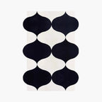 Nova black white modern irregular wavy shaped rug in black and white by Housenfriends on white background