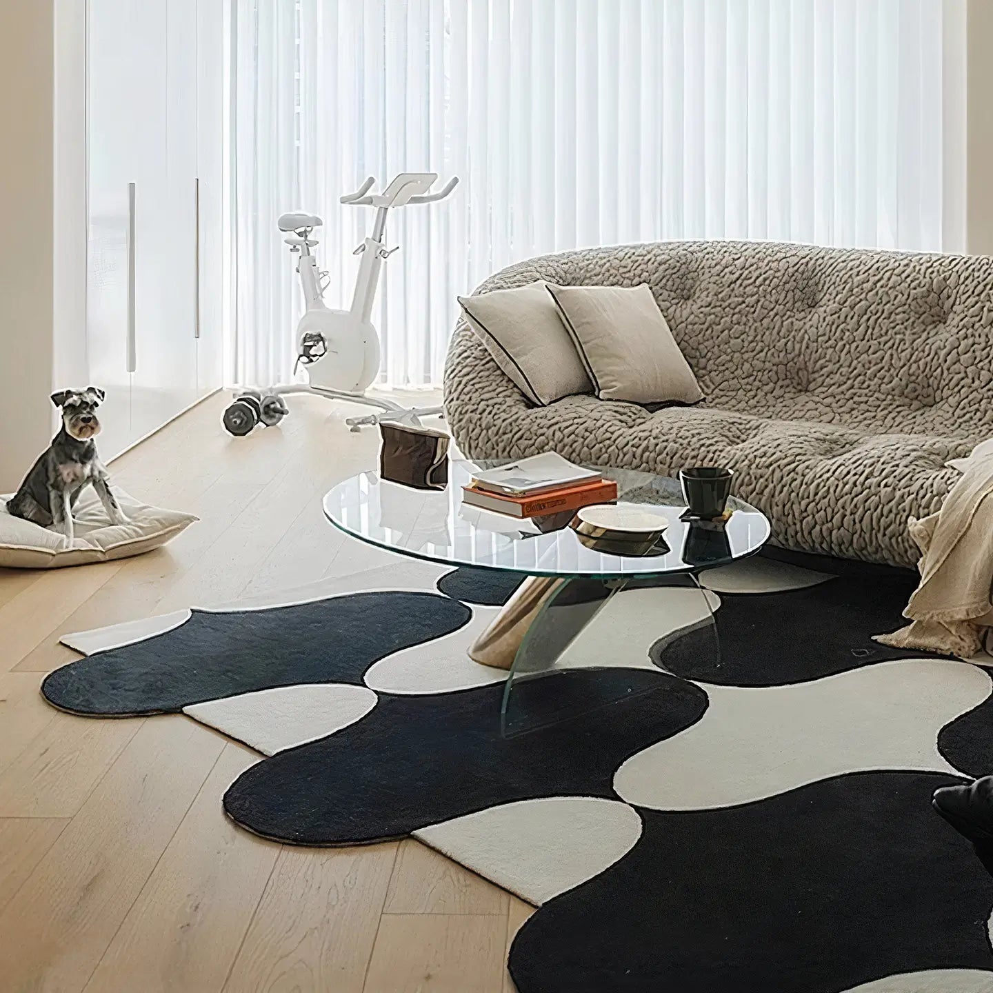 Modern living room with Nova black and white irregular wavy rug by Housenfriends under glass coffee table