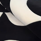 Close-up of Nova black and white irregular wavy rug by Housenfriends