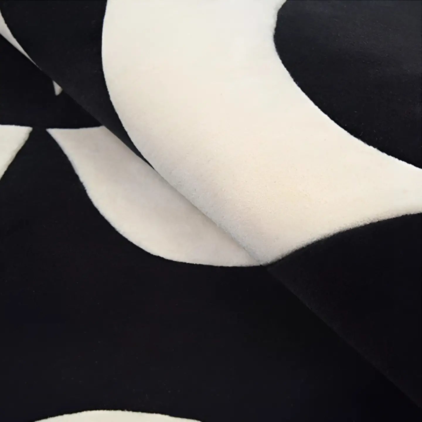 Close-up of Nova black and white irregular wavy rug by Housenfriends