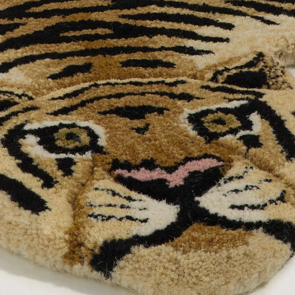 Close-up of Tibi small tiger-shaped wool rug by Housenfriends