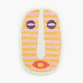 Milo Pink Small Oval Shaggy Modern African Mask Rug by Housenfriends on white background