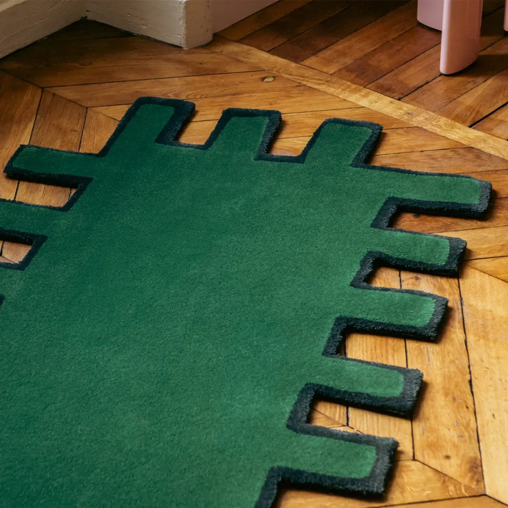 Biscuit Green shaggy abstract geometric rug with black border by Housenfriends on wooden floor 