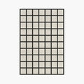 Studio Black and Cream Modern Grid Cut Pile Rug by Housenfriends on a white background