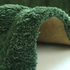 Close-up of Verdure Deep Green moss-inspired rug fabric from Housenfriends