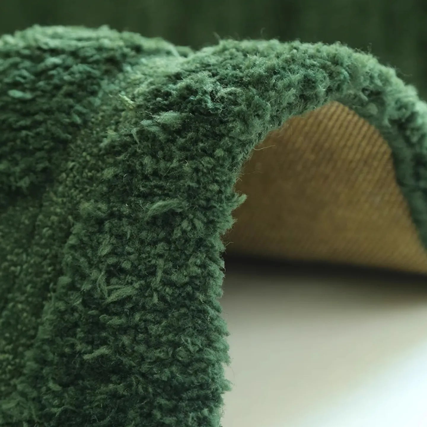 Close-up of Verdure Deep Green moss-inspired rug fabric from Housenfriends