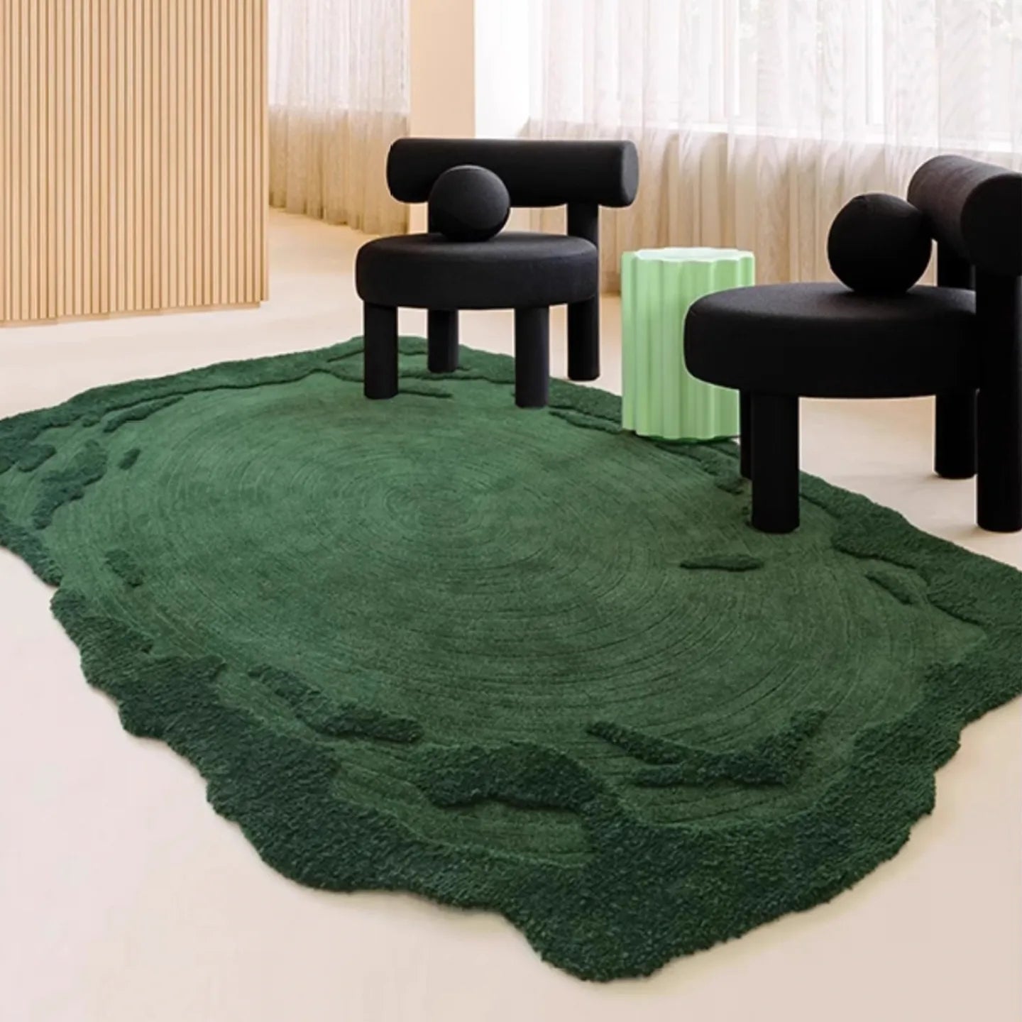 Verdure Deep Green moss-inspired rug with black modern chairs in modern room from Housenfriends
