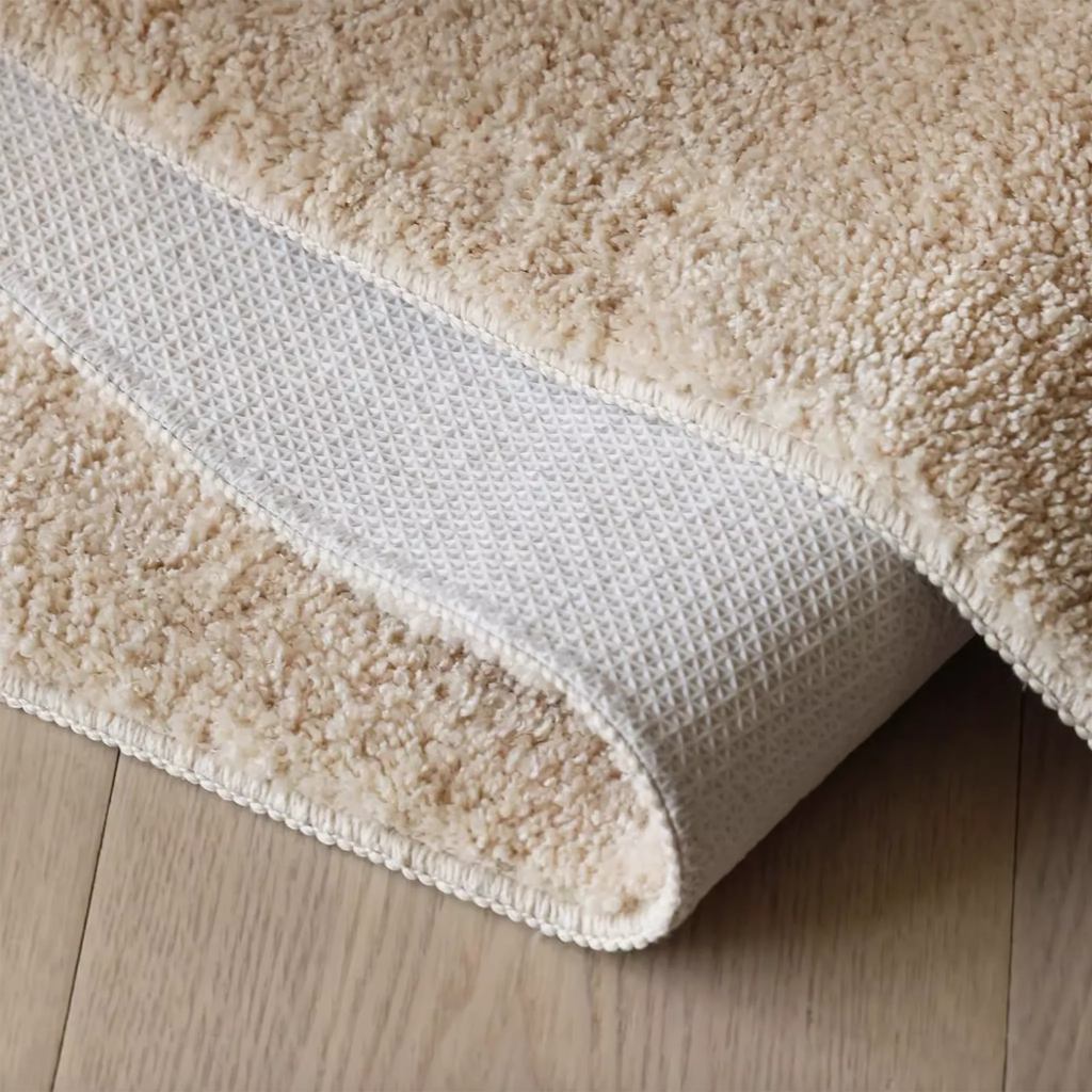 Alba Sand & Cream Mountain-Shaped High-Low Tufted Runner Rug by Housenfriends, non-slip backing shown on rolled corner