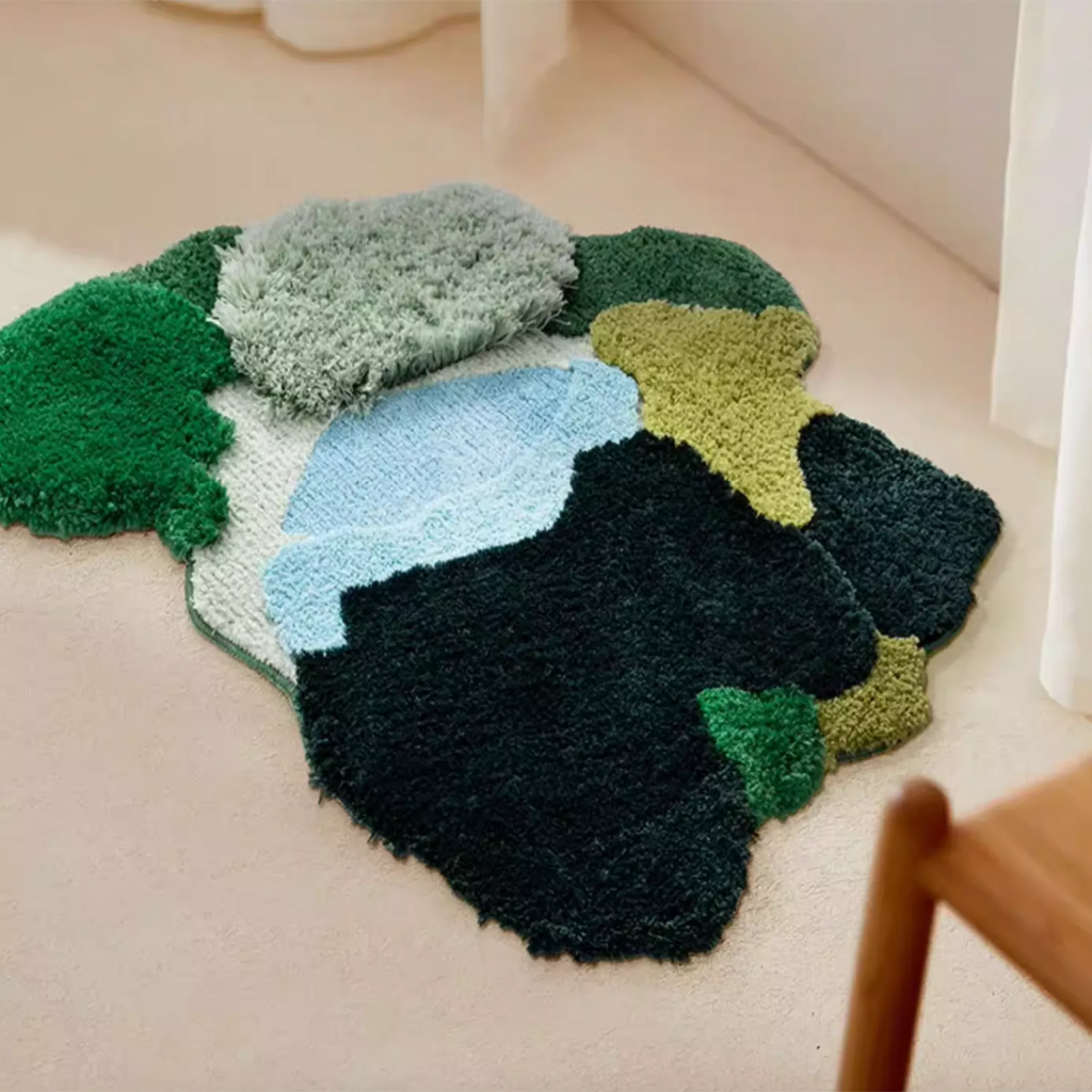 Alder Green Pondside High Low Tufted Irregular Rug in a corner, highlighting the plush textured pile and pond-inspired blue green colour blocks
