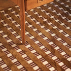 Amber Brown and Cream Checkered Textured Modern Rug with a wooden leg partially visible