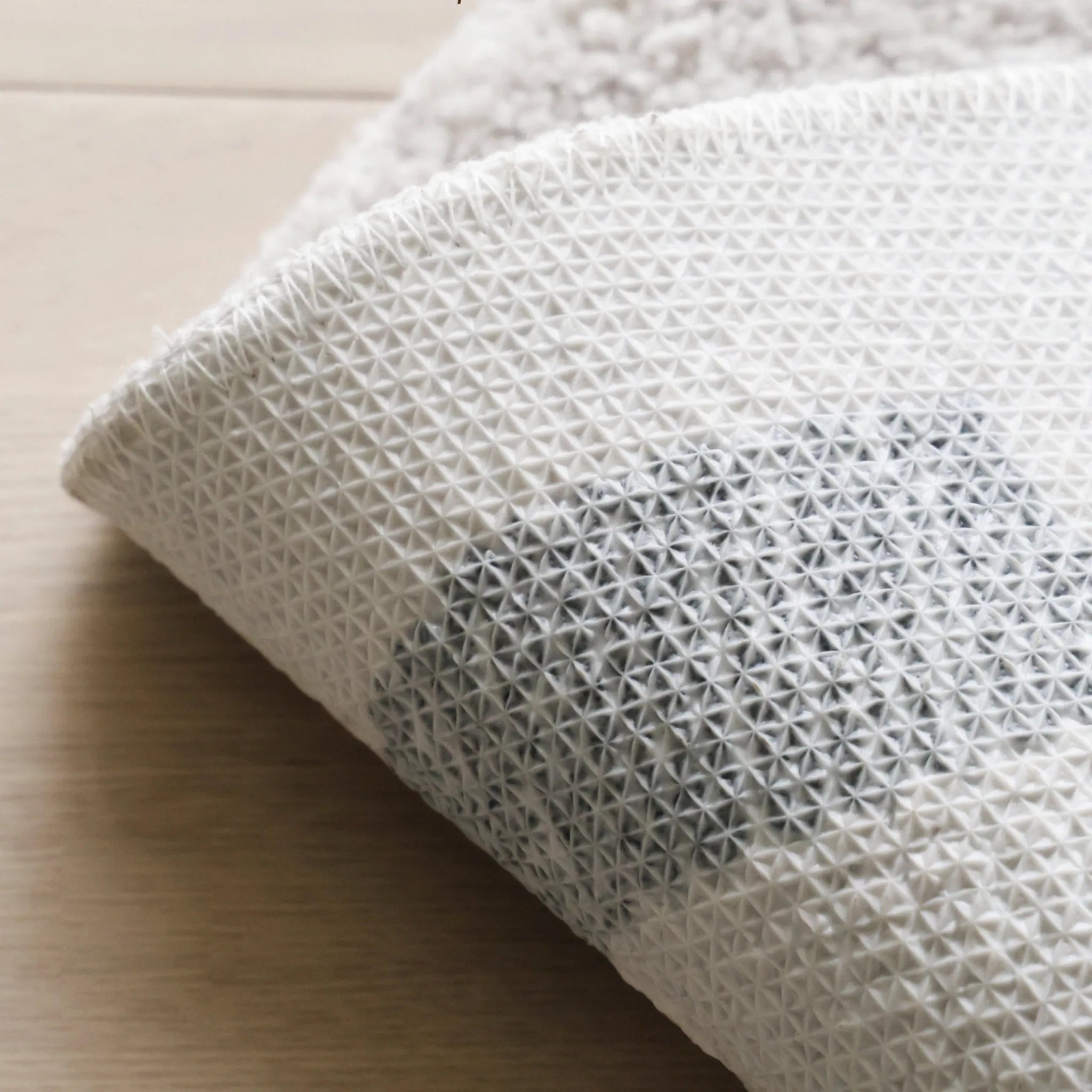 Elodie Cream & Beige Abstract Circle Round Tufted Rug by Housenfriends non-slip rug backing close-up, textured anti-slip underside