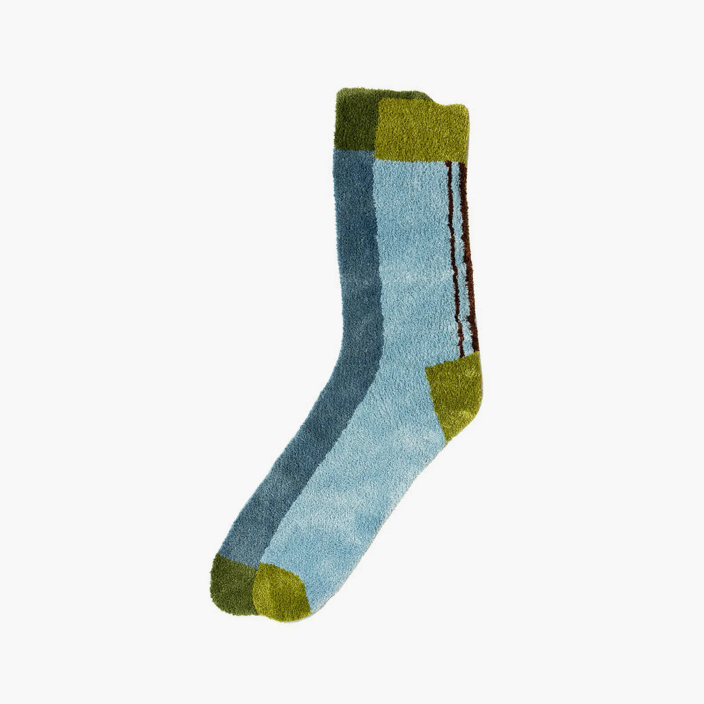 Blue and green graphic colourblock sock shaped tufted rug by Housenfriends on a white background