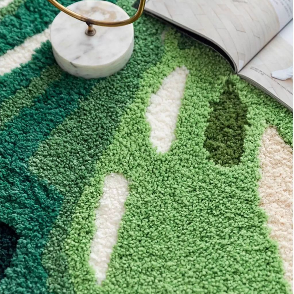 Cassia Forest Green Monstera Leaf Irregular Tufted Rug, close-up of the tufted texture and leaf vein carving