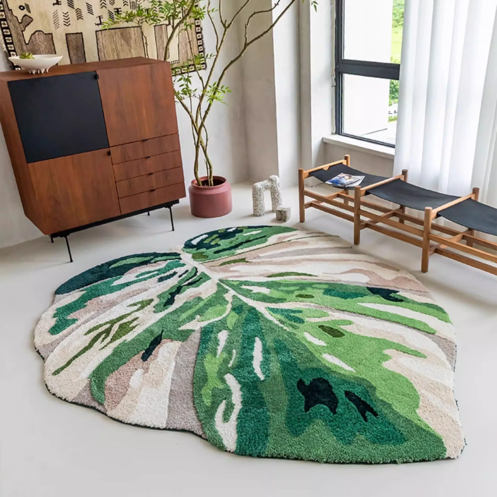 Cassia Forest Green Monstera Leaf Irregular Tufted Rug, styled in a living room showing scale and leaf outline