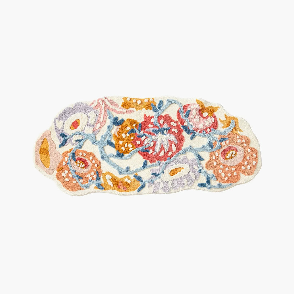 Celia colourful whimsical floral garden irregular tufted runner rug on a white background by Housenfriends