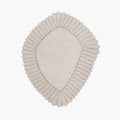Coquille Cream Irregular Seashell Shaped Sculpted Rug with ribbed border on a white background