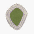 Coquille Green Seashell Shaped Sculpted Rug with cream ribbed border on a white background