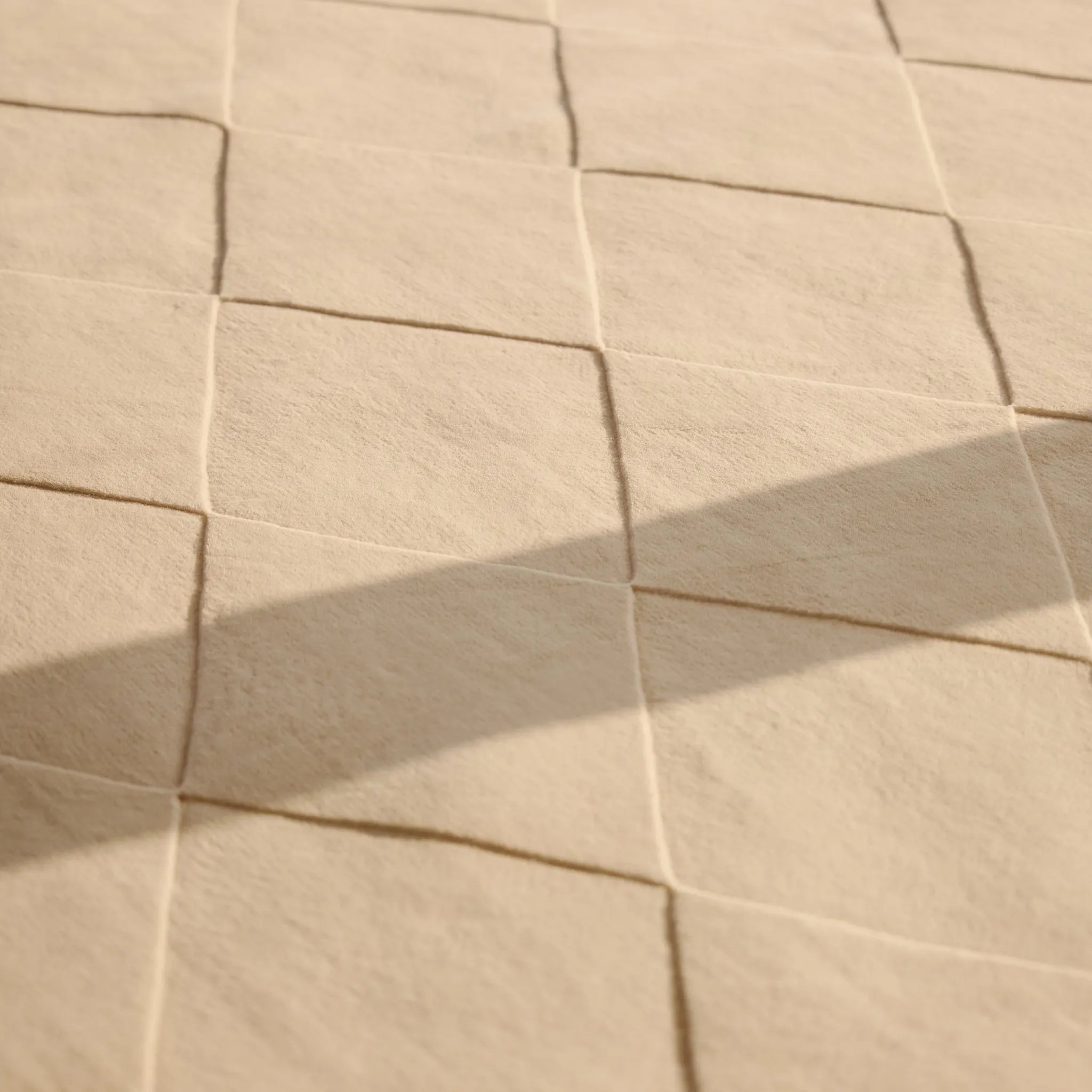 Close-up of the texture of the Cream Diamond Modern High Low Hand Tufted Rug