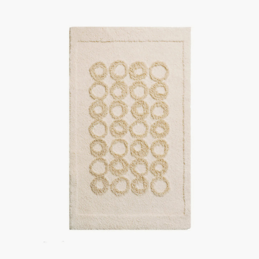 Nola Cream Beige Sculpted Circle High Low Tufted Rug by Housenfriends on a white background