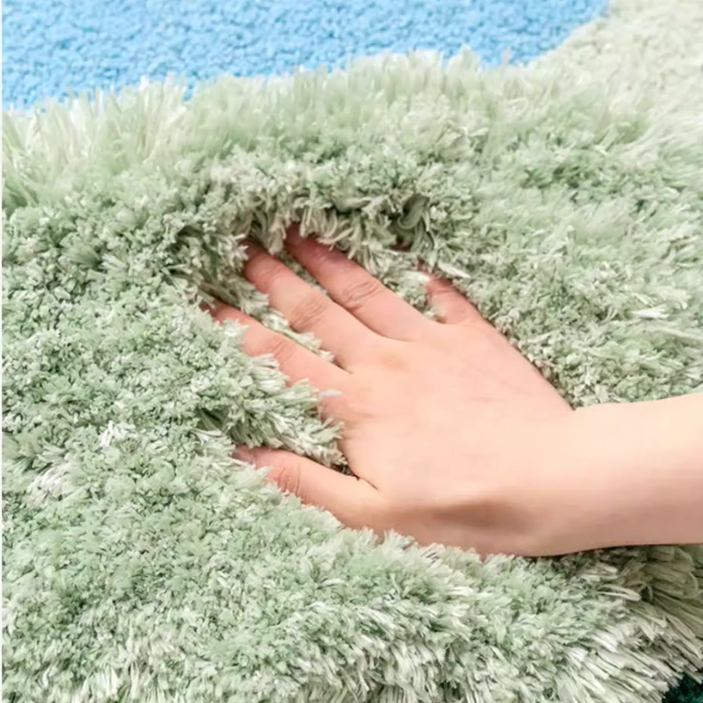 Alder Green Blue Pondside Tufted Irregular Rug by Housenfriends, hand pressed into plush sage green fibres with textured high low pile