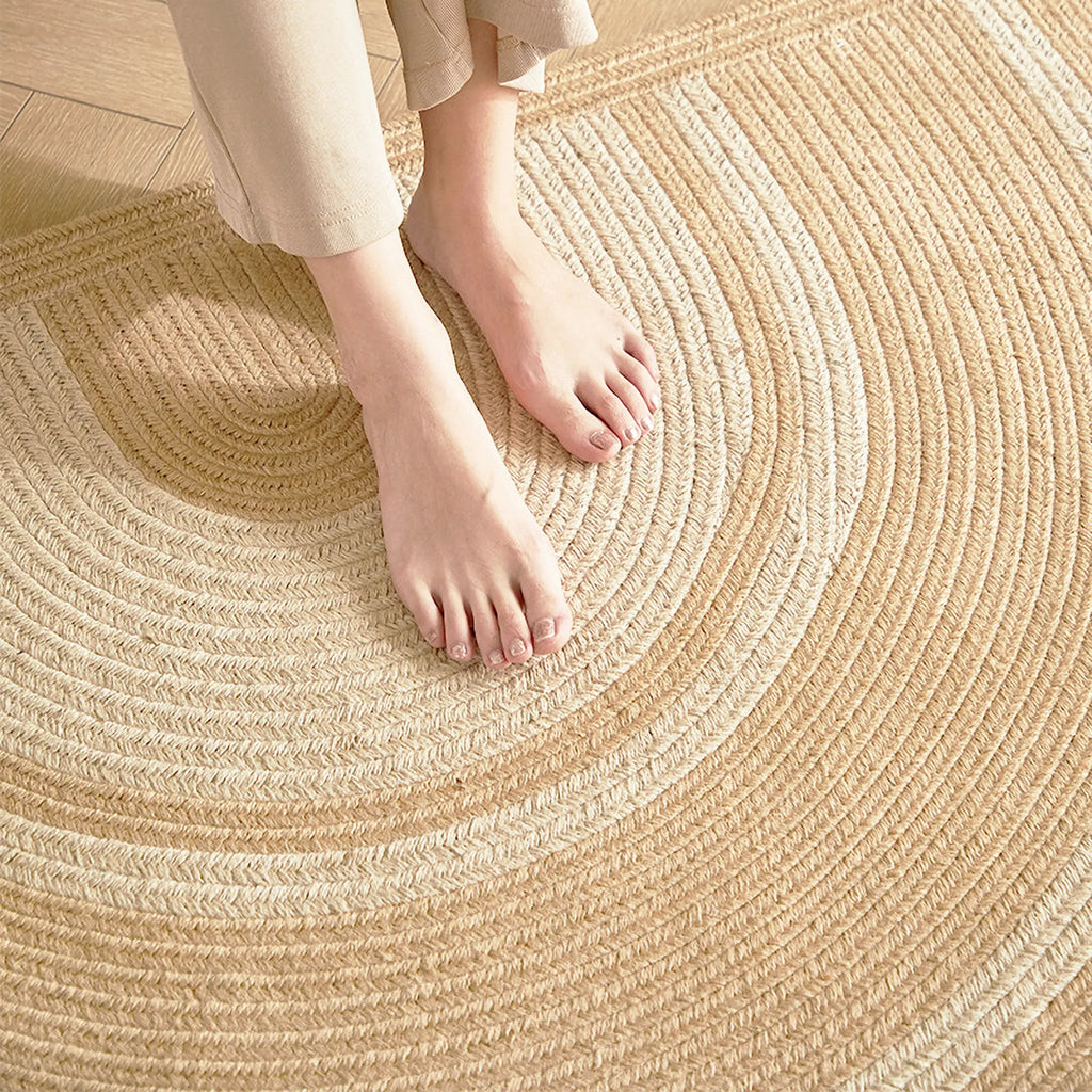 Elina Beige & Natural Jute-Blend Braided Half Moon Rug Housenfriends with a person's feet on it
