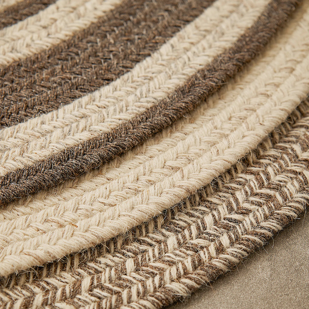 Close-up of edges of Elina Brown & Beige Wool-Blend Braided Half Moon Rug