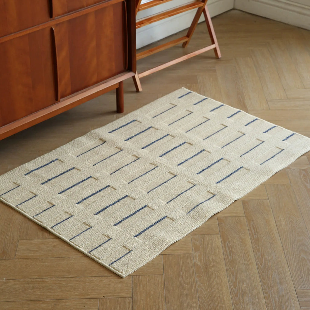 Housenfriends Elio Beige & Navy Striped High-Low Textured Rug styled in a living room corner