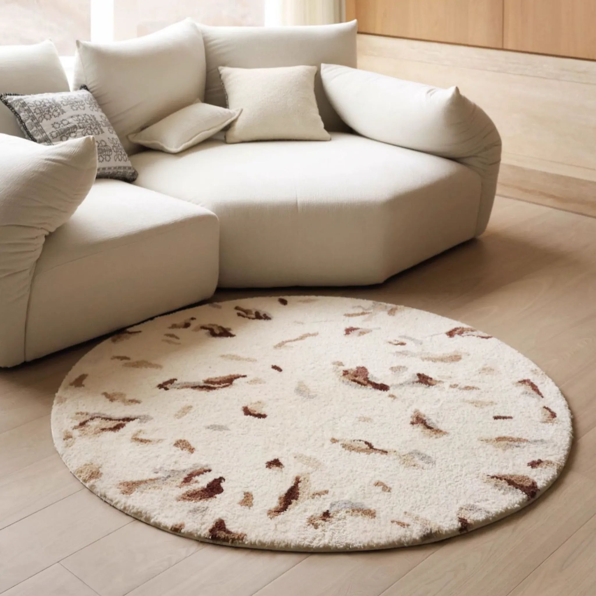 Elodie Cream & Brown Abstract Speckled Round Tufted Rug by Housenfriends in a neutral living room, round cream rug with brown speckled pattern