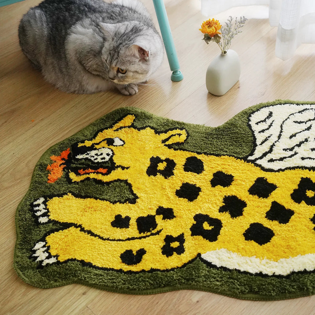 Yellow and olive green winged leopard shaped tufted rug with a cat nearby, styled on a wooden floor by Housenfriends