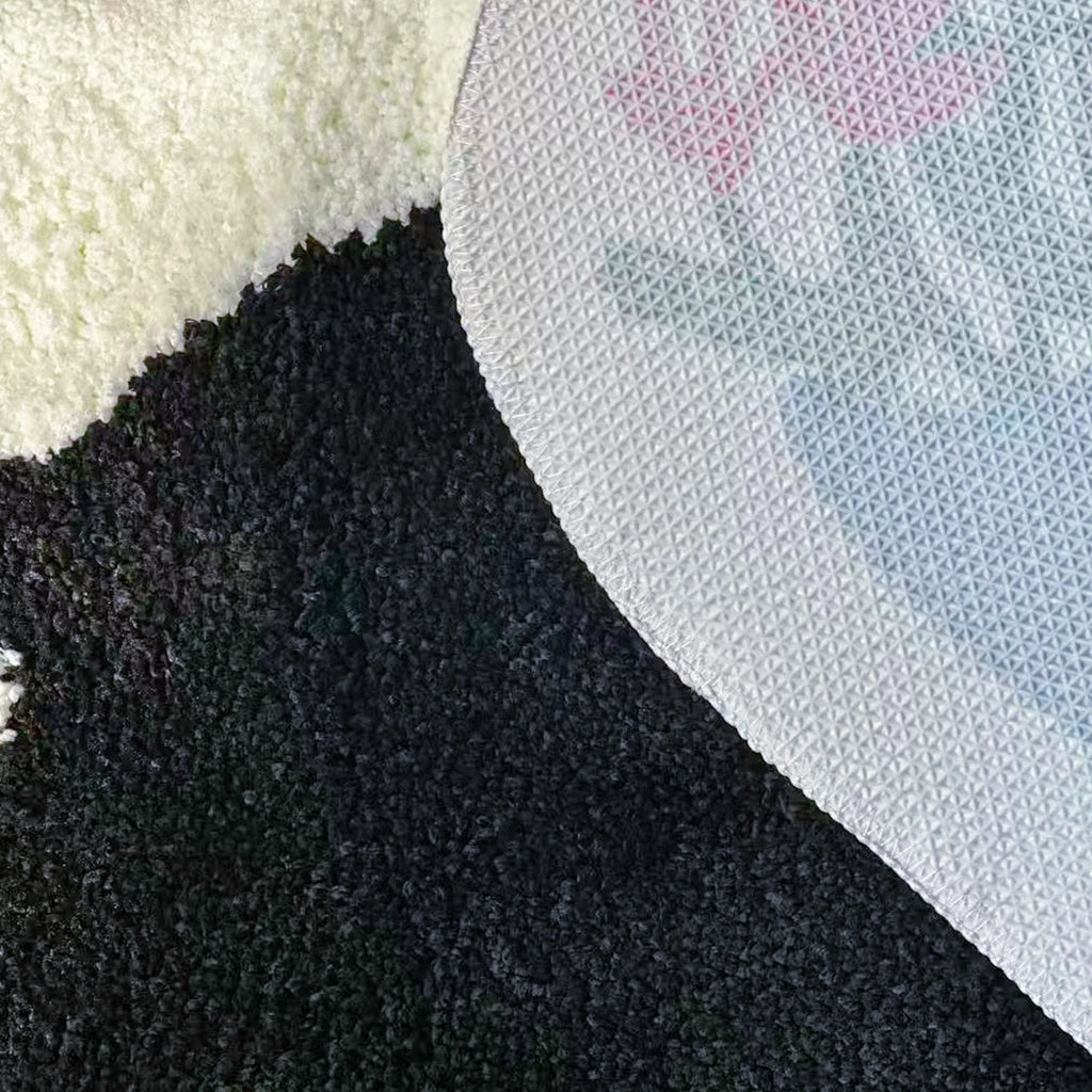 Close-up of texture fabric and a white non-slip backing of Floral Black Cat Shaped Designer Tufted Rug