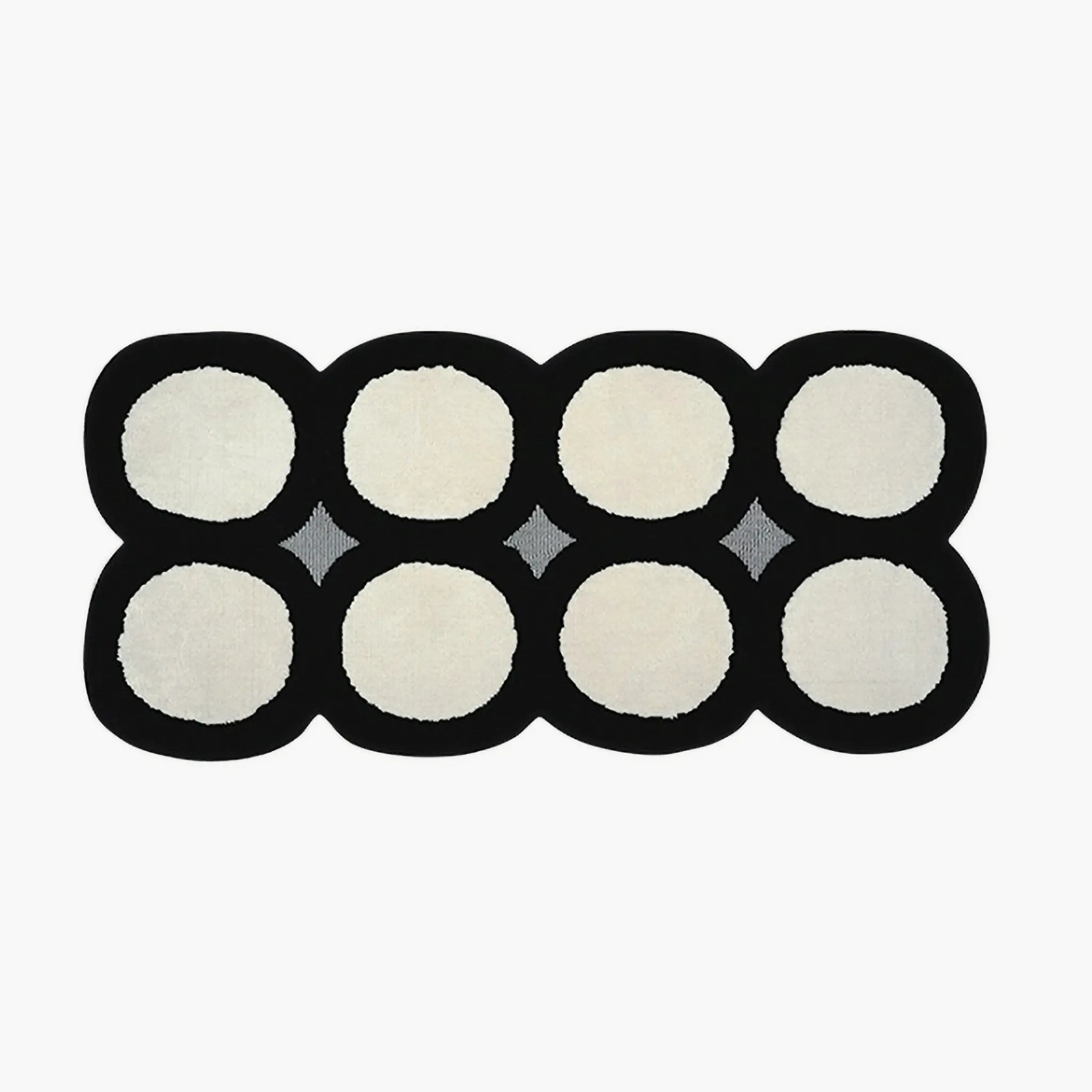 Harper Black and White Irregular Polka Dots Tufted Rug by Housenfriends on a white background