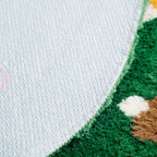 Close-up of the non-slip backing of Elora Moss Green Round Mushroom Rug by Housenfriends