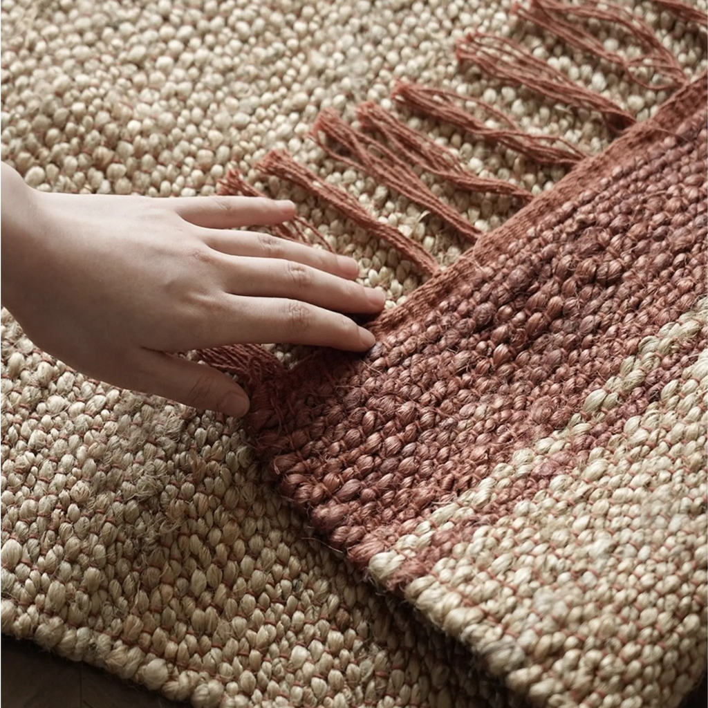 Maren Natural & Warm Brown Fringed Handwoven Jute Rug by Housenfriends, close-up texture and fringe detail