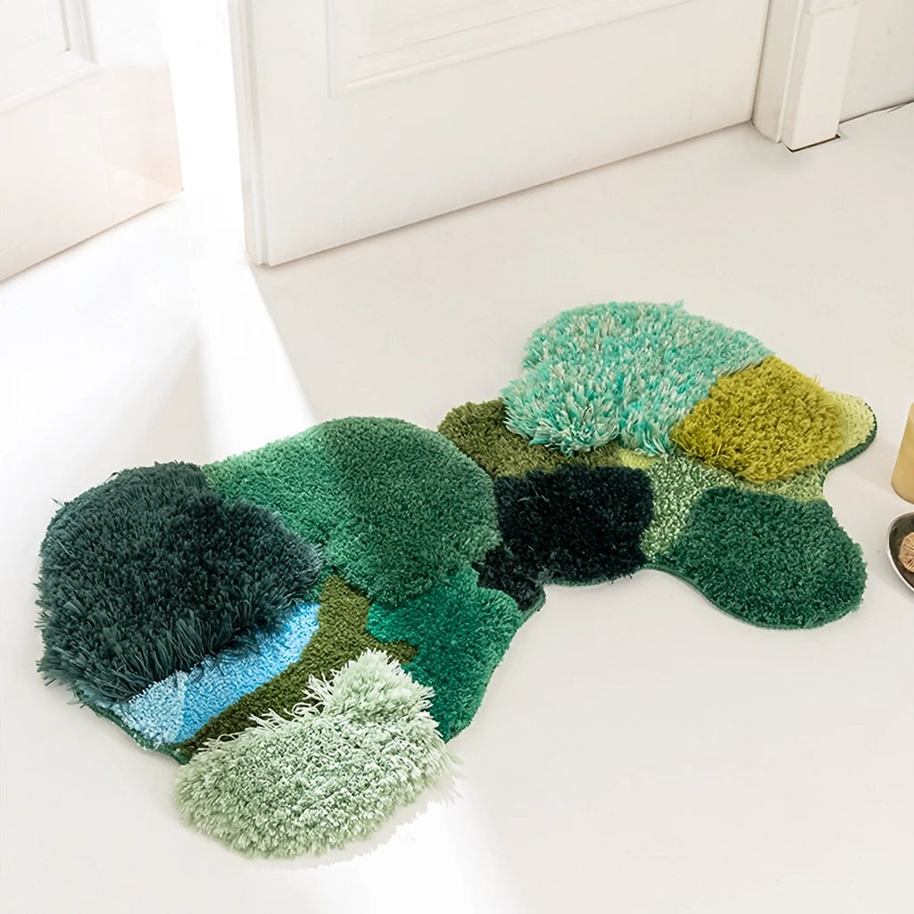 Elowen and Marlow irregular rugs by Housenfriends layered together in a calm interior, mixing textured greens and organic shapes for a soft, nature-led home feel