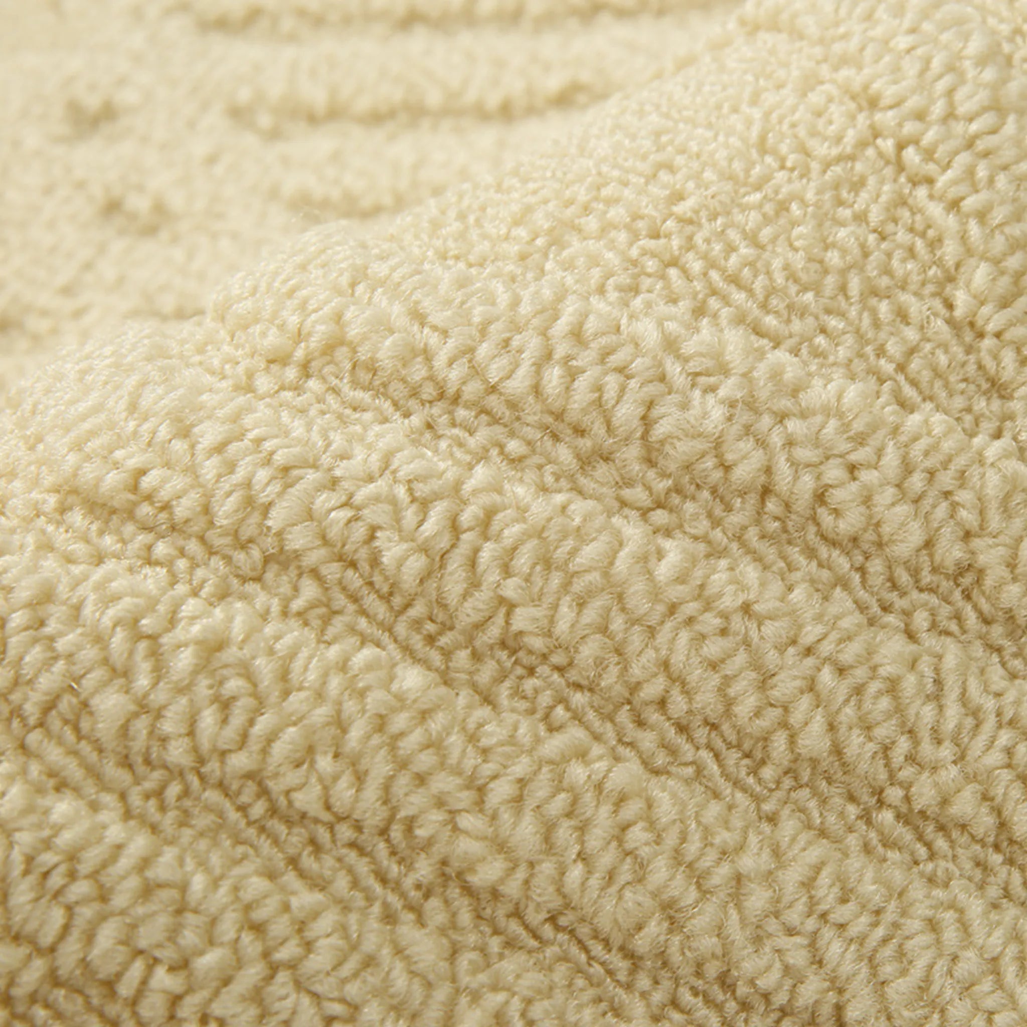 Housenfriends Nori cream rug close-up with soft looped high-low pile