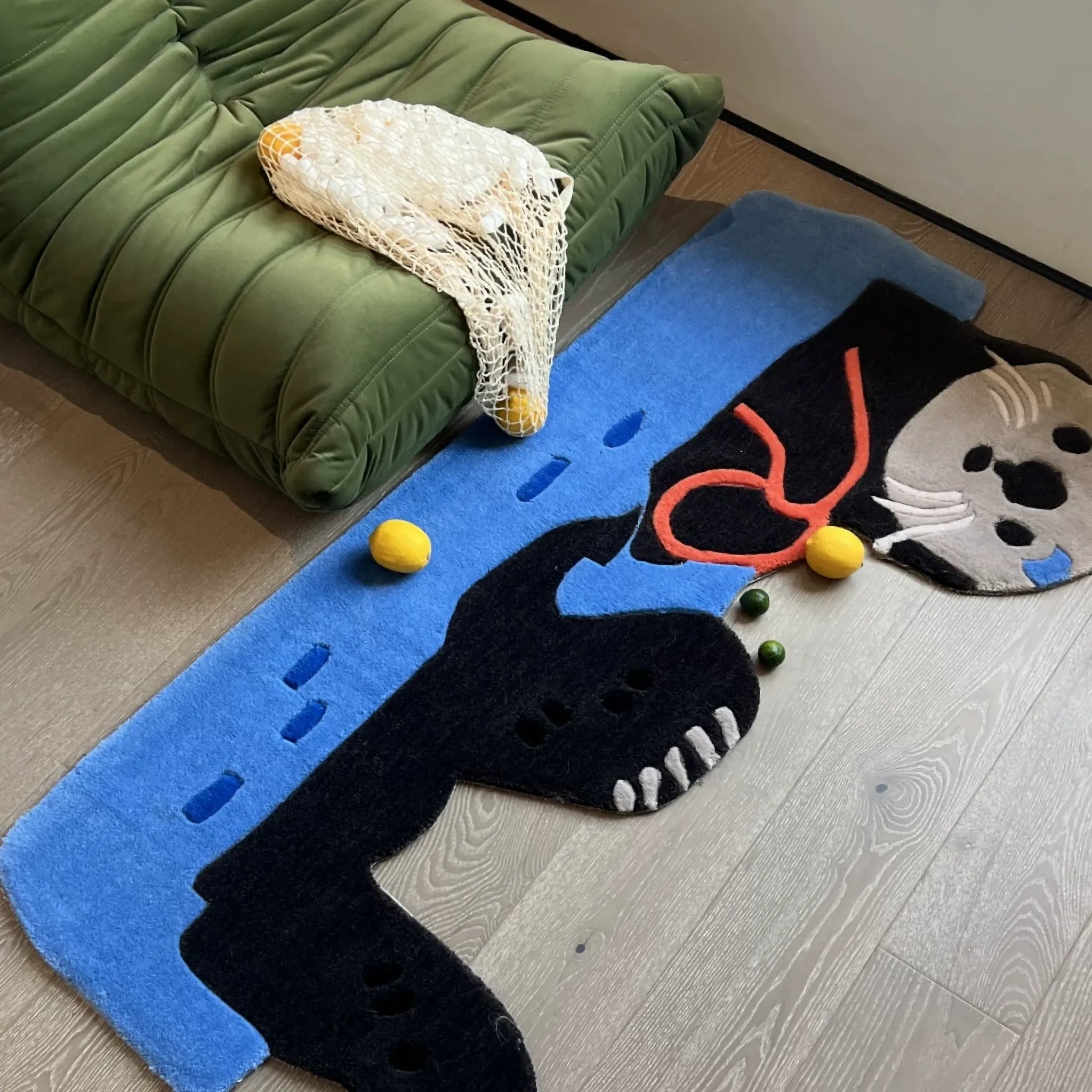 Oona Blue Water Sea Otter Shaped Graphic Tufted Rug