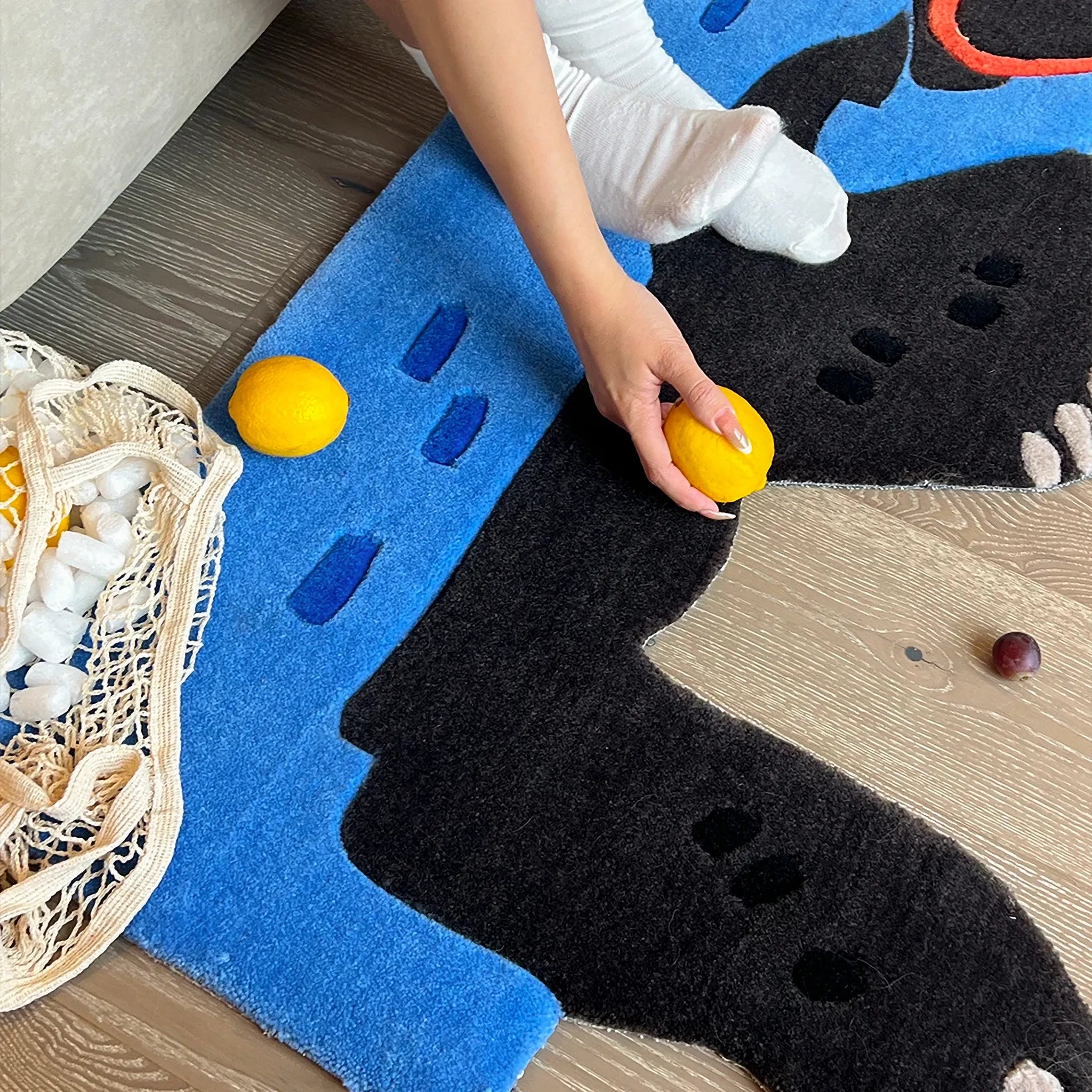 Oona Blue Water Sea Otter Shaped Graphic Tufted Rug